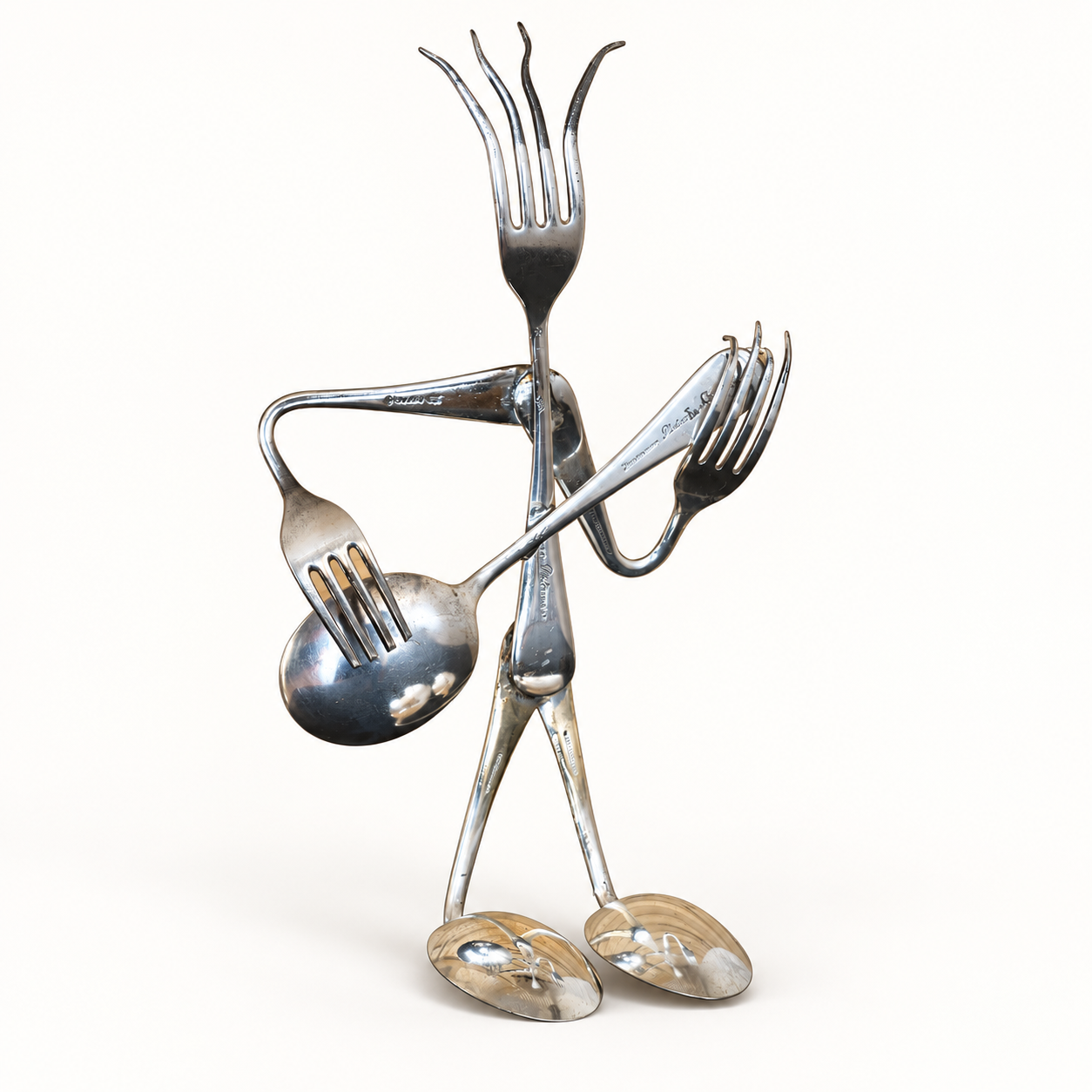 Whimsical musician sculpture made from reclaimed forks, spoons and cutlery